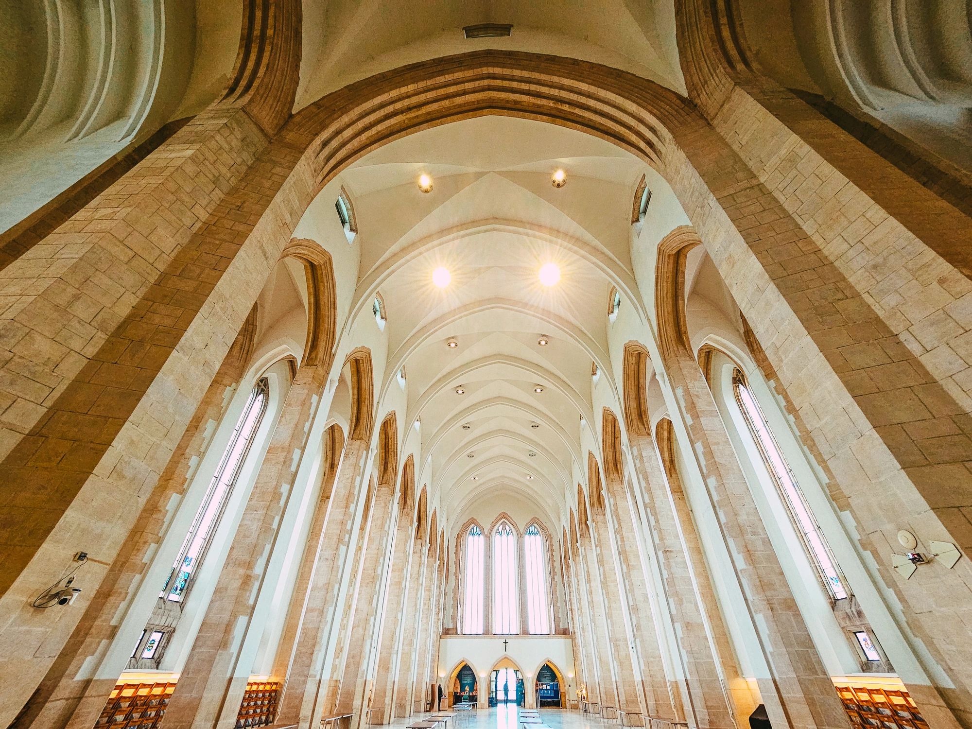Sunlit cathedral interior ceiling